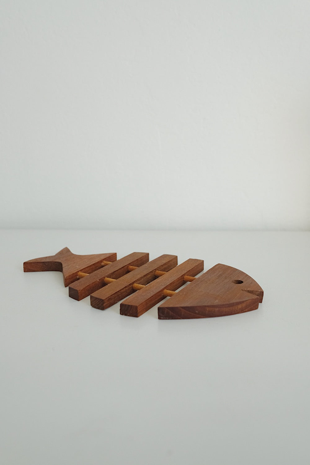 teak fish trivet