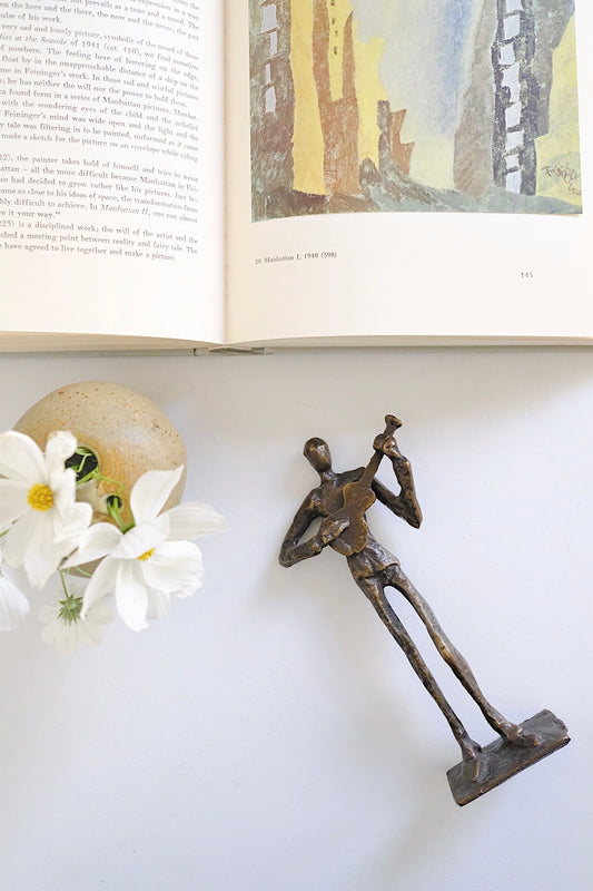 cast bronze guitarist