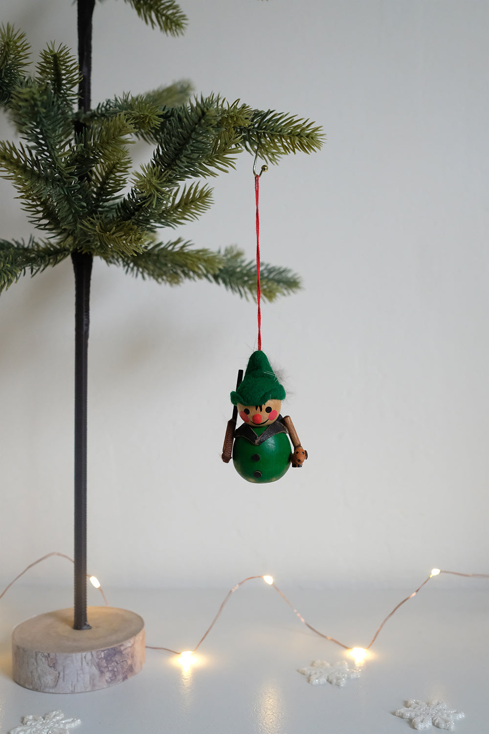 wooden hunter with puppy ornament