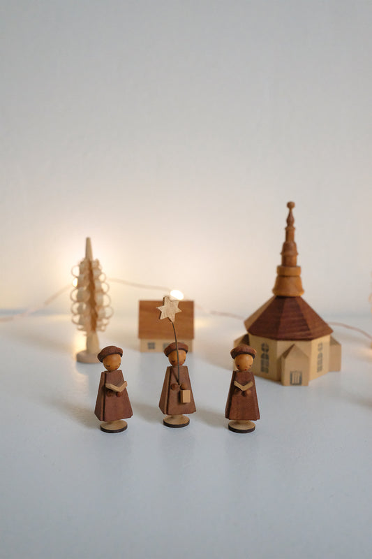 handmade wooden carolers scene