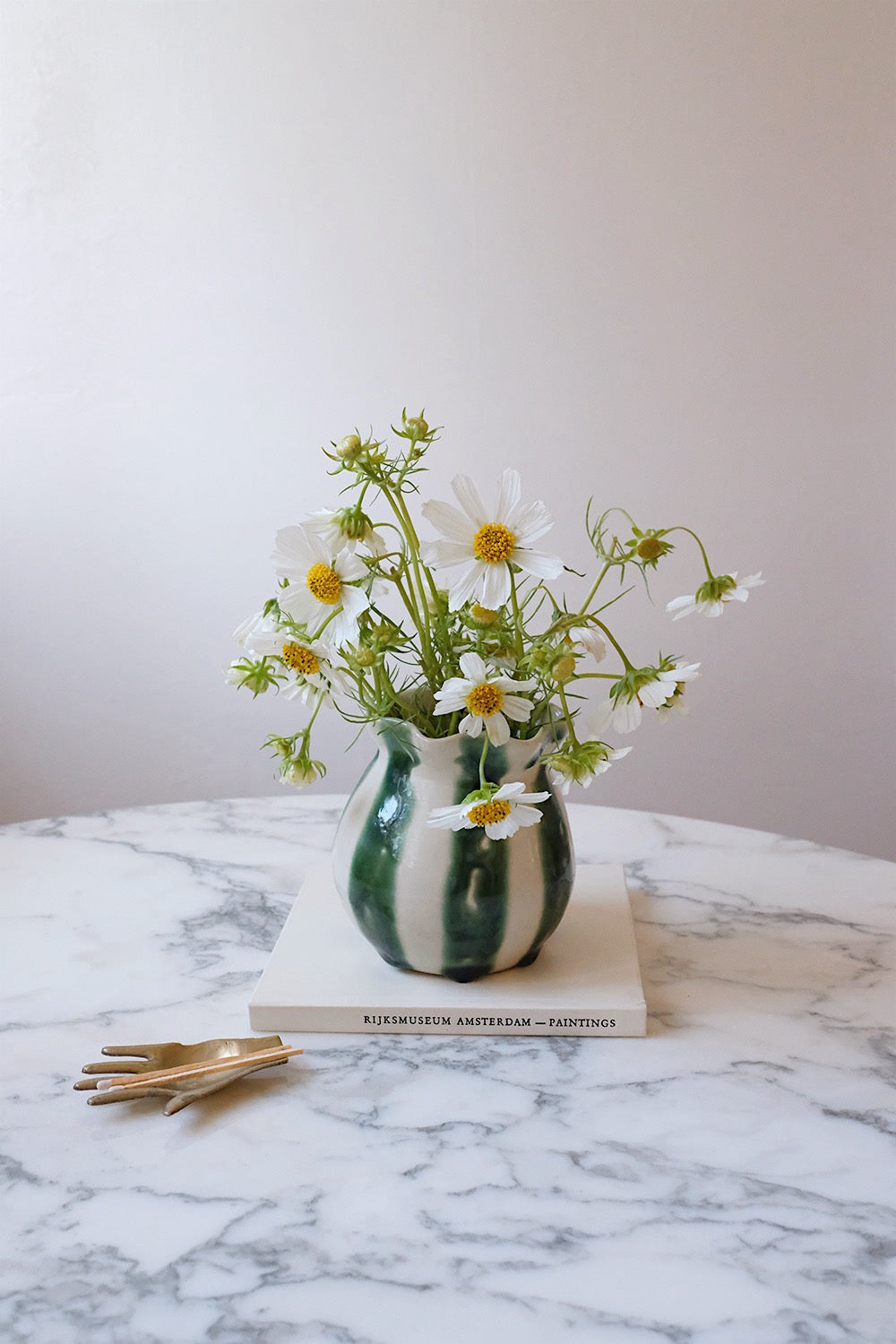 striped vase with glass flower frog