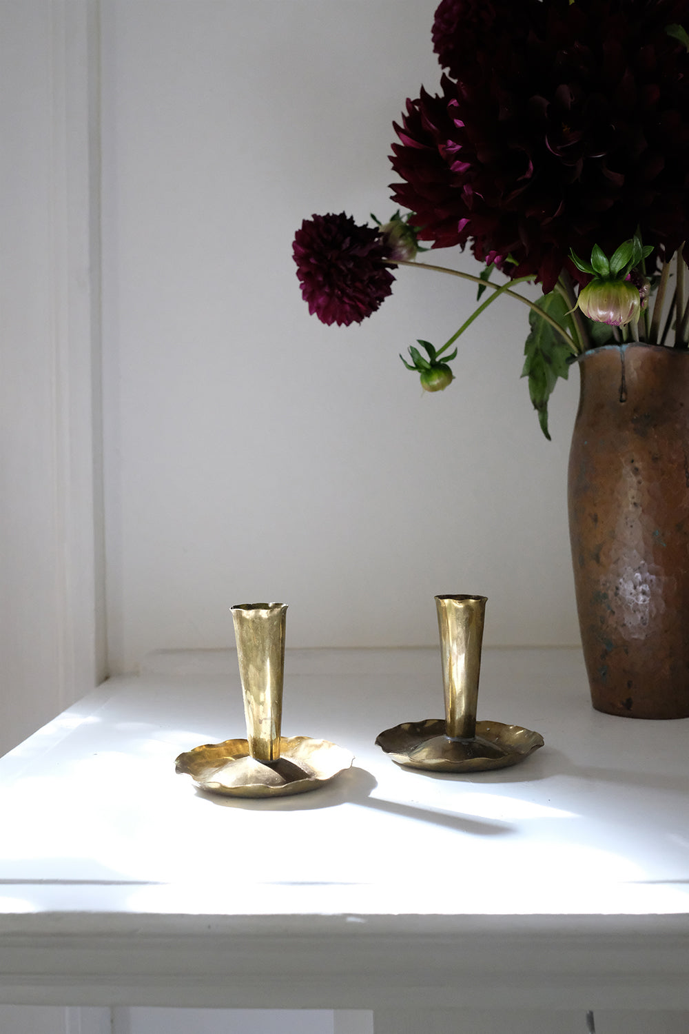 brass skirted candlesticks - set of 2