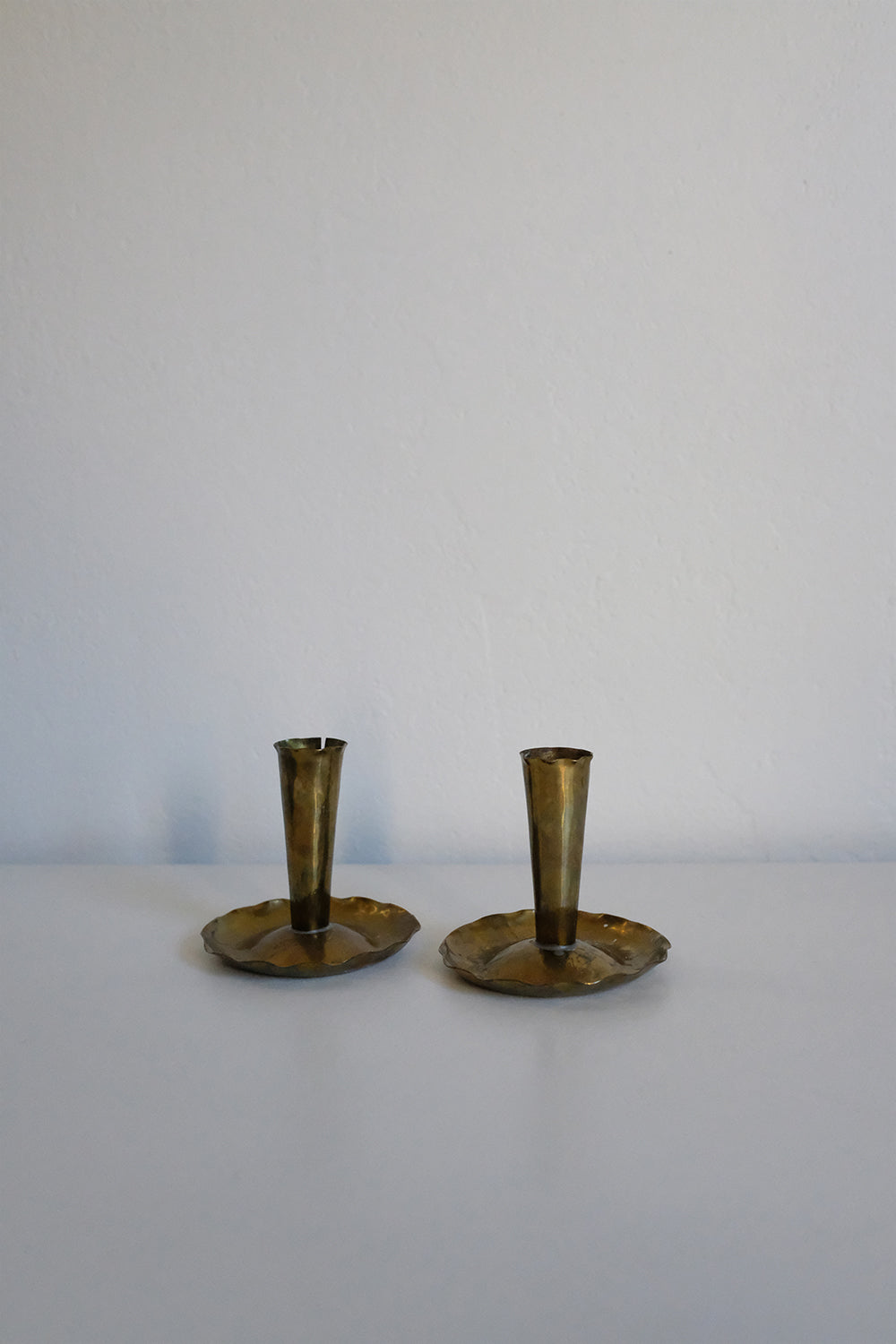 brass skirted candlesticks - set of 2